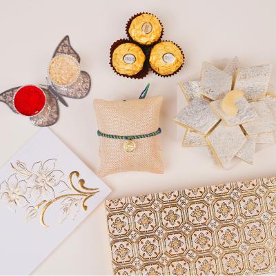 Auspicious Coin Om Rakhi & Gourmet Sweets