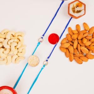Twin Protection & Wholesome Treats Set - Rakhi and Dry Fruits to USA