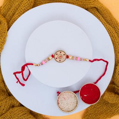 Sacred Om Charm Rakhi & Kaju Katli Delight
