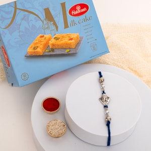 Sacred Silver Tone Ganesha Rakhi with Milk Cake