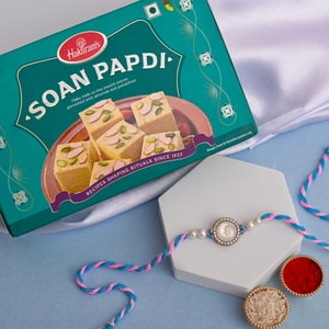 Sacred Trishul Pearl Rakhi with Soan Papdi