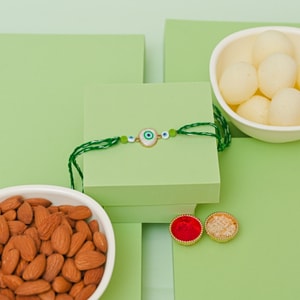 Nazar Raksha Rakhi with Rasgulla & Almond Gift Hamper