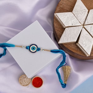 Evil Eye Pearl Rakhi with Premium Kaju Katli Hamper