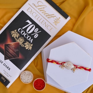 Divine Pearl Om Rakhi with Lindt Chocolate Hamper