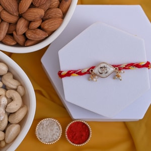 Sacred Om Pearl Rakhi with Almonds & Cashews