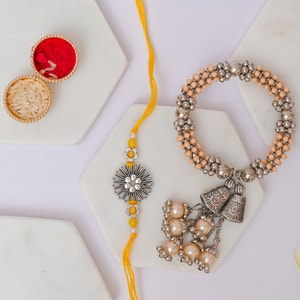 Peach Floral Bhai Bhabhi Rakhi Duo