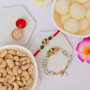 Lotus Bhai Bhabhi Rakhi with Rasgulla & Cashew Hamper