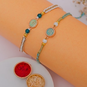 Rose Gold Om Rakhi Duo