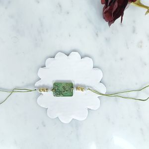 Resin Swastik Delight Rakhi