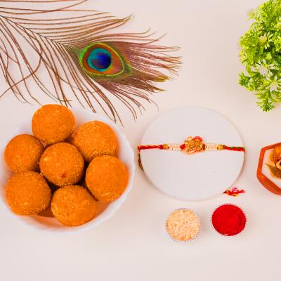 Pearl-Ganesha Divine Grace Rakhi & Besan Laddu - Rakhi Sweets to USA