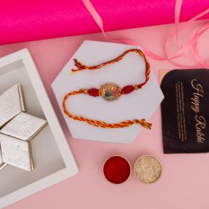 Golden Peacock Rakhi with Kaju Katli