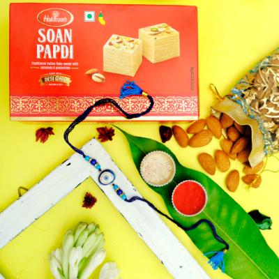 Blue Charm Protection & Traditional Sweetness - Rakhi and Dry Fruits to USA