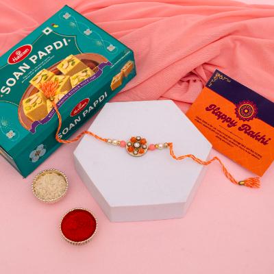Sunset Bloom Rakhi & Soan Papdi Delight