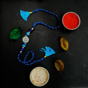 Azure Charm Evil Eye Tassel Rakhi
