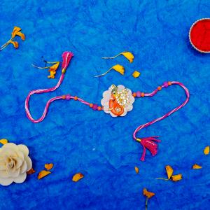 Radiant Blessings Orange Ganesha Rakhi