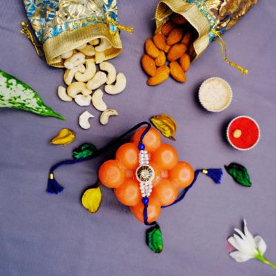 Sparkling Blue Serenity & Nutty Elegance Rakhi - Rakhi and Dry Fruits to USA