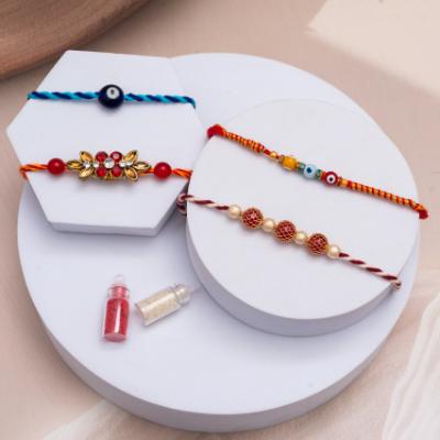 Elegant Quartet: Subtle & Strong Bonds - Set of 5 Rakhis to USA
