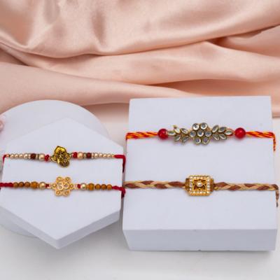 Quartet of Connection: Four Threads of Love - Set of 5 Rakhis to USA
