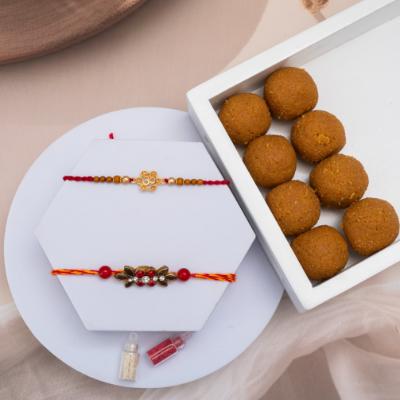 Om & Stone Rakhi Set with Besan Laddu - Set of 2 Rakhis to USA