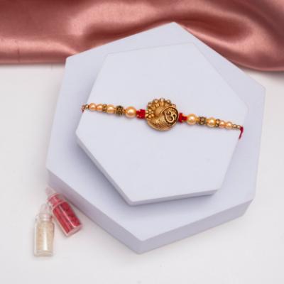 Tranquil Om Symbol Metal Rakhi