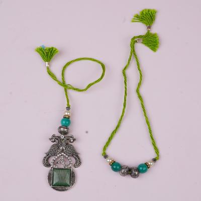 Verdant Kundan Oxidized Rakhi Pair