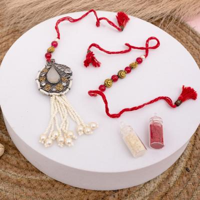 Crimson Glow Milky Stone Rakhi Pair