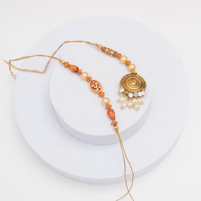 Sacred Bond Om & Gold Metallic Rakhi Set