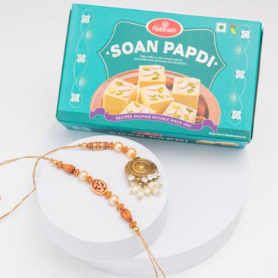 Divine Glow Om Rakhi Set with Soan Papdi