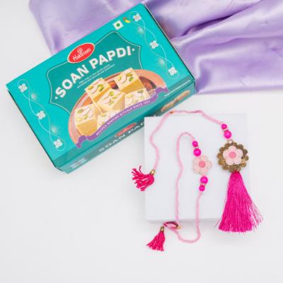 Rosy Bloom Rakhi & Soan Papdi Delight