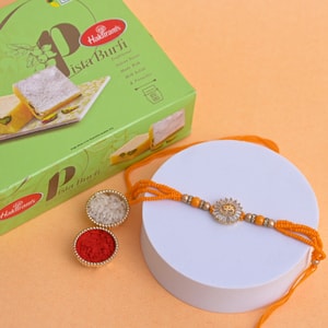 Radiant Om Rakhi with Pista Burfi