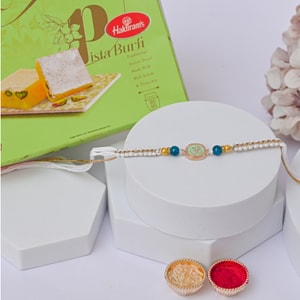 Pastel Om Designer Rakhi with Pista Burfi
