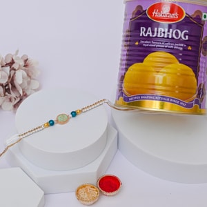 Pastel Om Rakhi with Raj Bhog Sweets