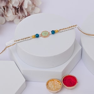 Pastel Om Blessings Rakhi