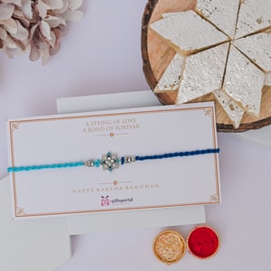 Blue Crystal Flower Rakhi with Kaju Katli