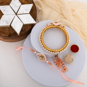 Peach Pearl Bhaiya Bhabhi Rakhi with Kaju Katli