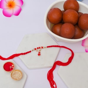 Red Designer Lumba Rakhi with Gulab Jamun