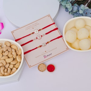 Om Rakhi Trio with Cashew & Rasgulla Hamper